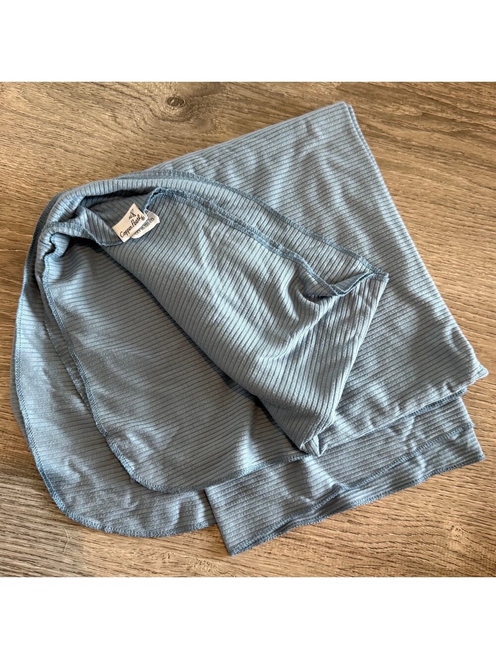 Copper Pearl, blue knit baby swaddle